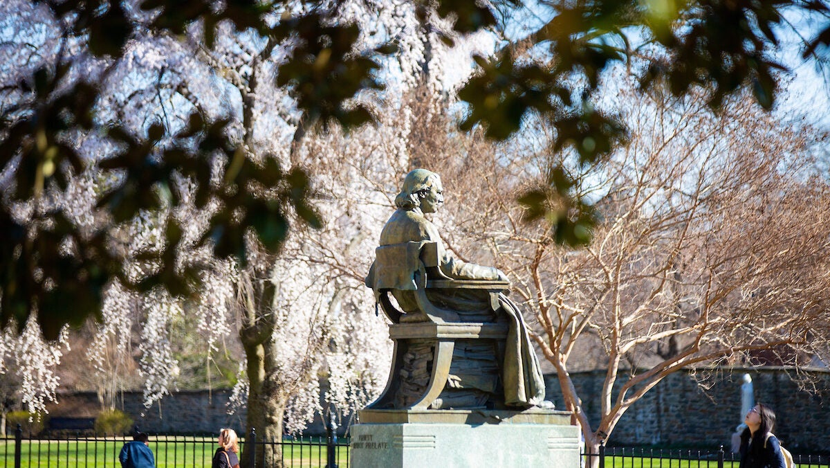An image of John Carroll statue on the front lawn of Georgetown's campus.